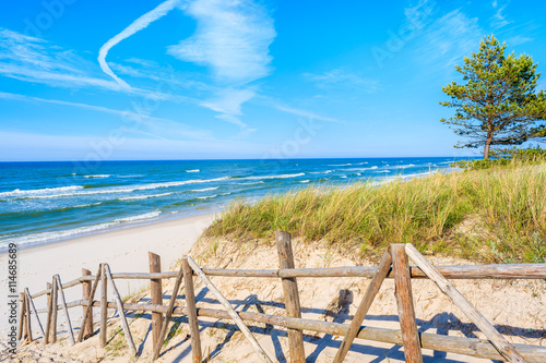 Entrance to beautiful sandy beach in Bialogora coastal village, Baltic Sea, Poland