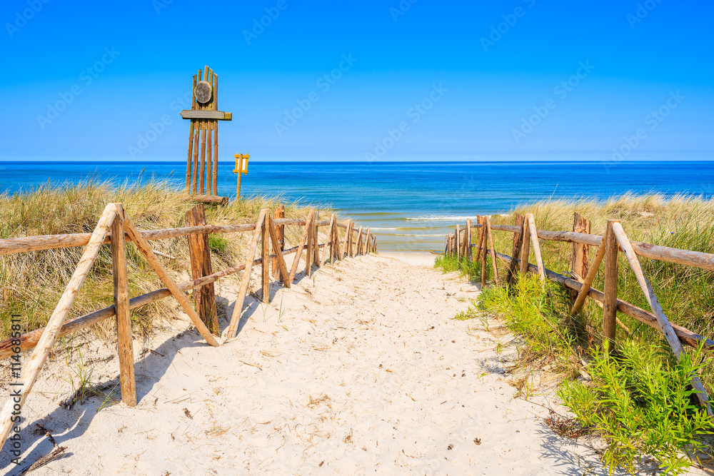 Entrance to beautiful sandy beach in Lubiatowo coastal village, Baltic Sea, Poland - obrazy, fototapety, plakaty 