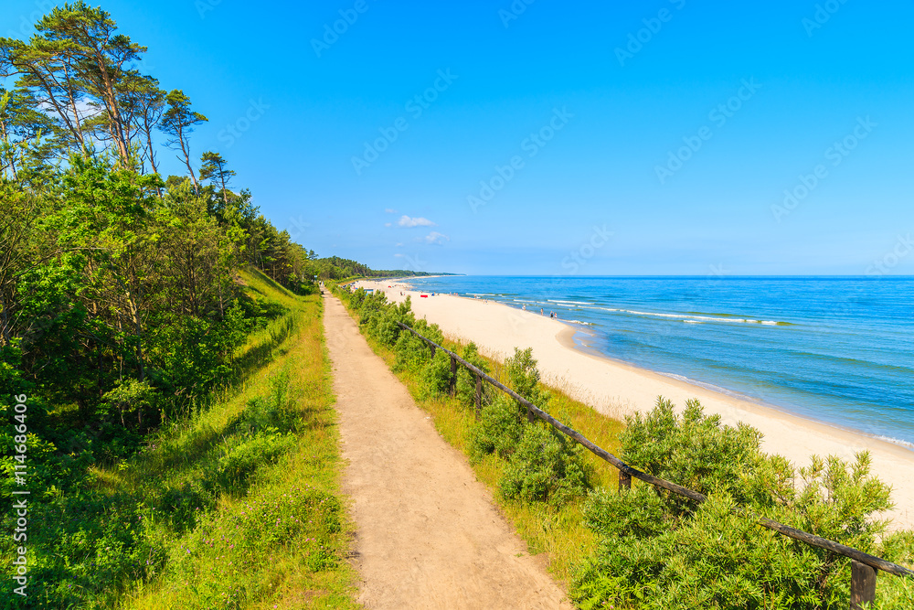 Coastal path along beautiful sandy beach in Jastrzebia Gora village, Baltic Sea, Poland