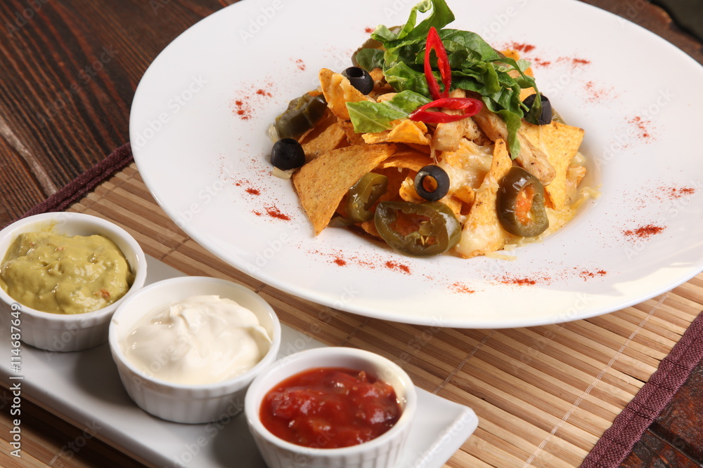 Salad with nachos and sauce guacamole Salad with nachos and sauce guacamole