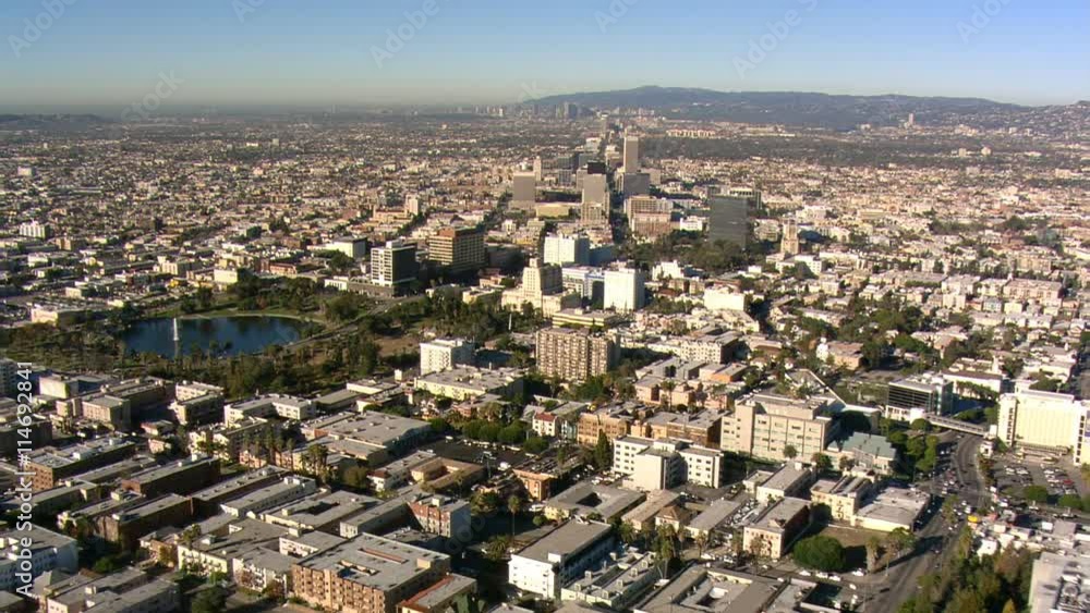 Flight approaching Los Angeles high-rises with valley and smog beyond. Shot in 2008.