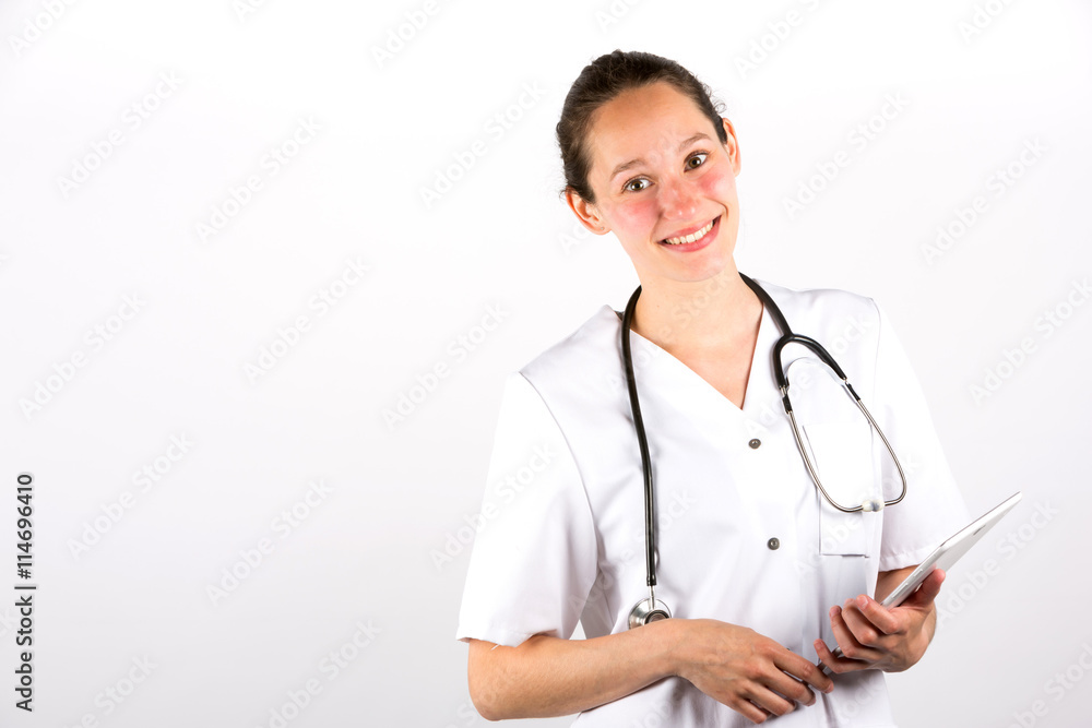Smiling medical doctor woman with stethoscope on a white backgro