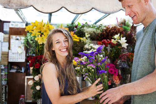 Man gifting flowers to his girlfriend photo