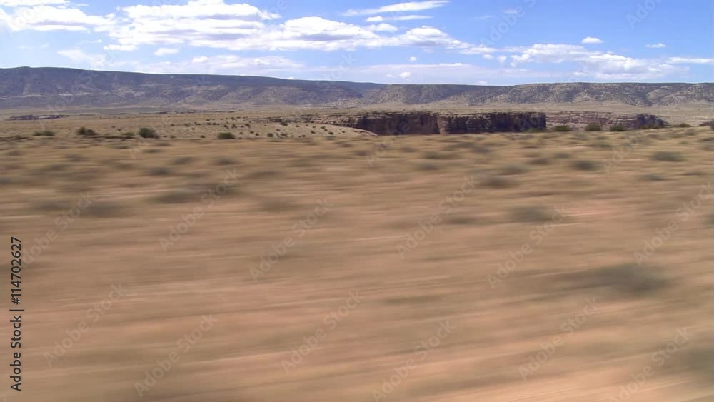 Rushing flight over plateau, with drop into gorge Rushing flight over plateau, with drop into gorge