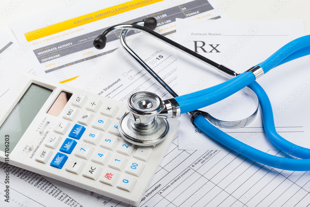 Health care costs. Stethoscope and calculator Health care costs. Stethoscope and calculator