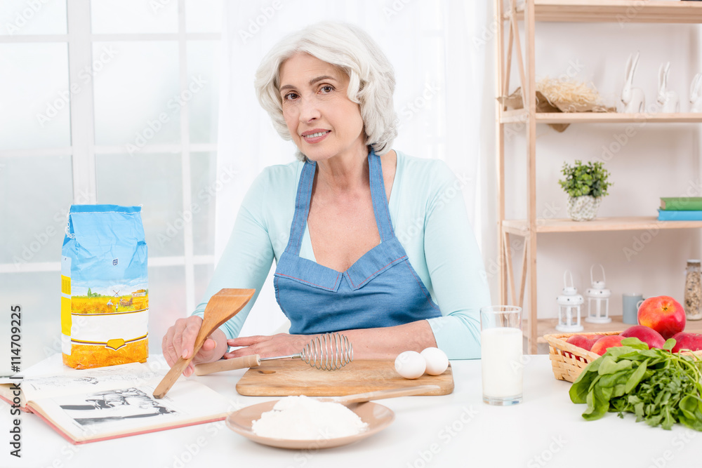 Nice looking adult woman at kitchen Nice looking adult woman at kitchen