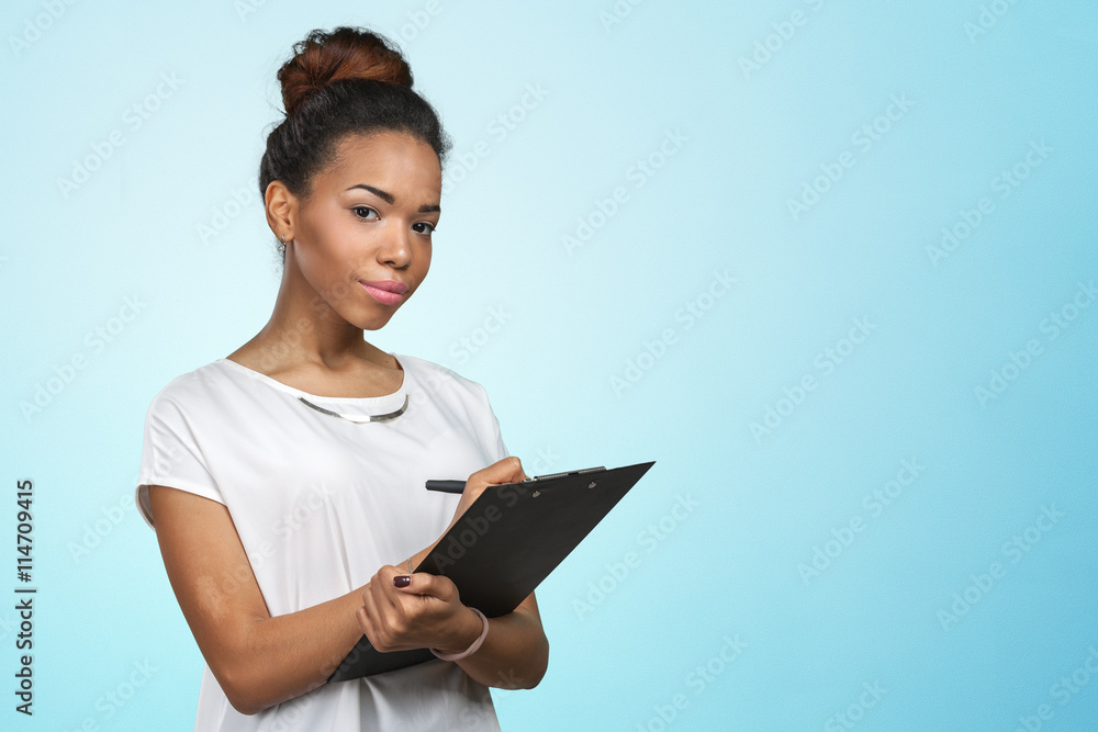 young beautiful african american woman with clipboard young beautiful african american woman with clipboard