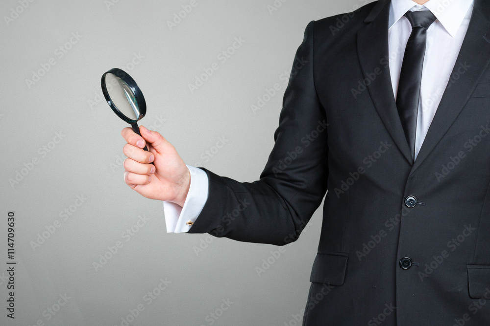 business man holding magnifying glass concept business man holding magnifying glass concept