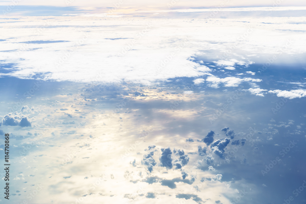 Fototapeta premium Aerial view from an airplane on a cloudy day.