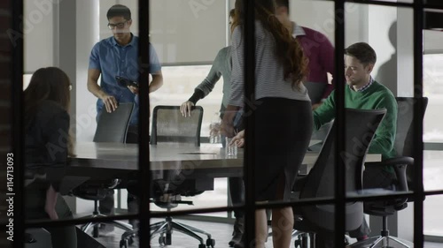 Medium shot of business people sitting in meeting / Lehi, Utah, United States