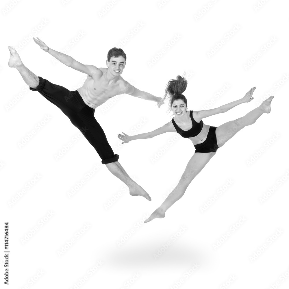 colorless portrait of couple man and woman jumping on white background