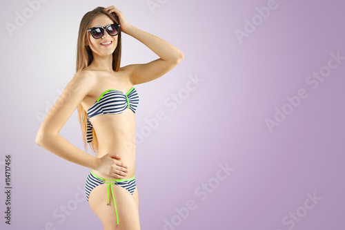 Blonde girl in striped bikini © fotofabrika