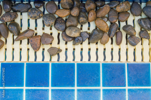 Small stone decorating on the swimming pool