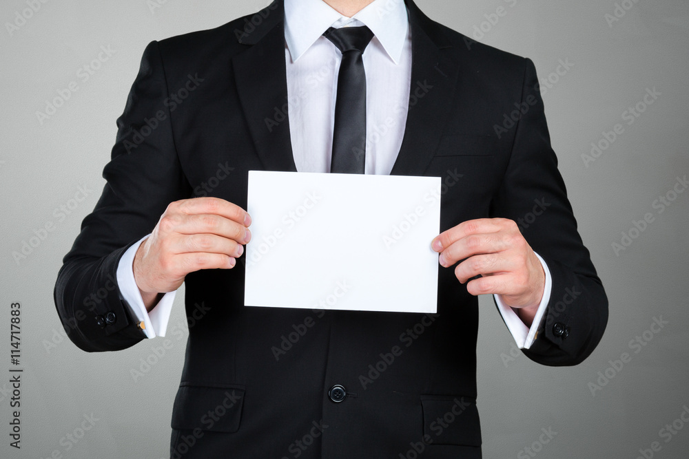 Businessman showing his business card Businessman showing his business card