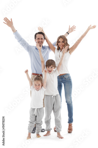 Happy family with raised hands © alotofpeople