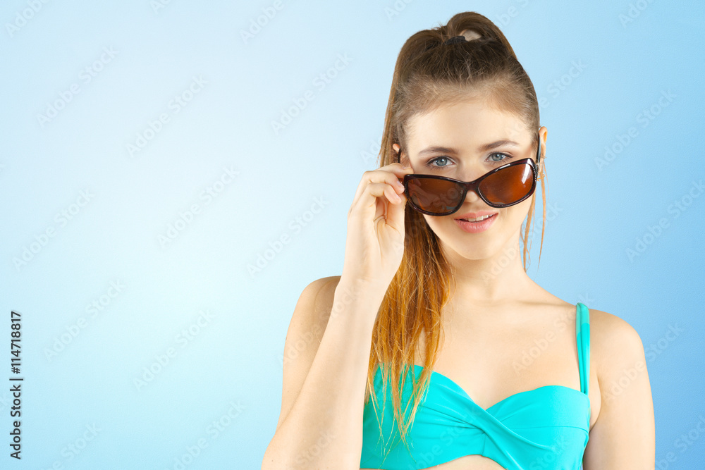 Portrait of a beautiful young woman posing in bikini Portrait of a beautiful young woman posing in bikini