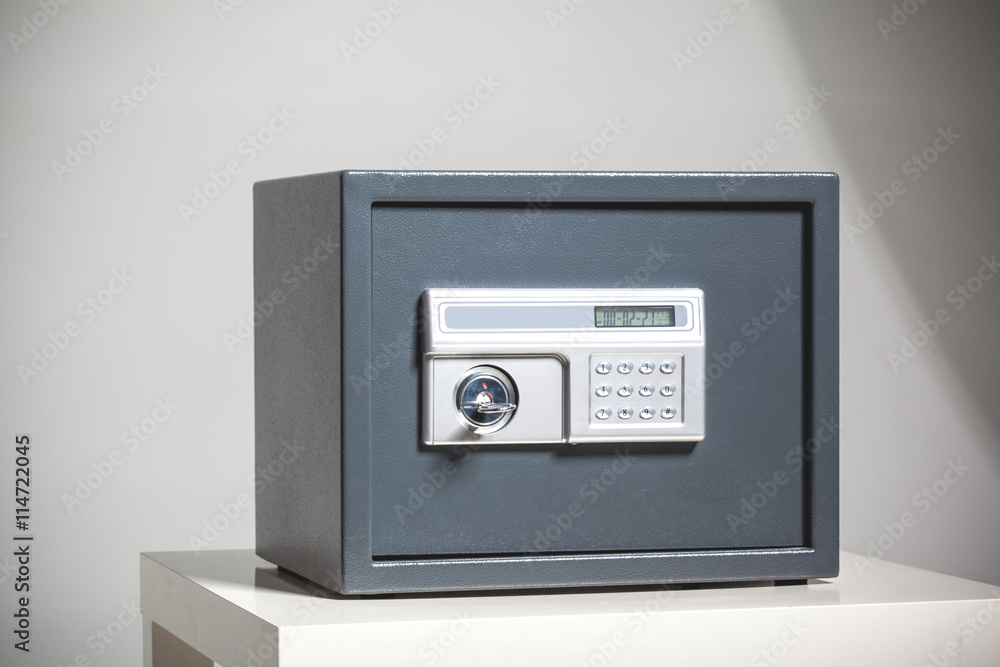 Closed safe on grey background Closed safe on grey background