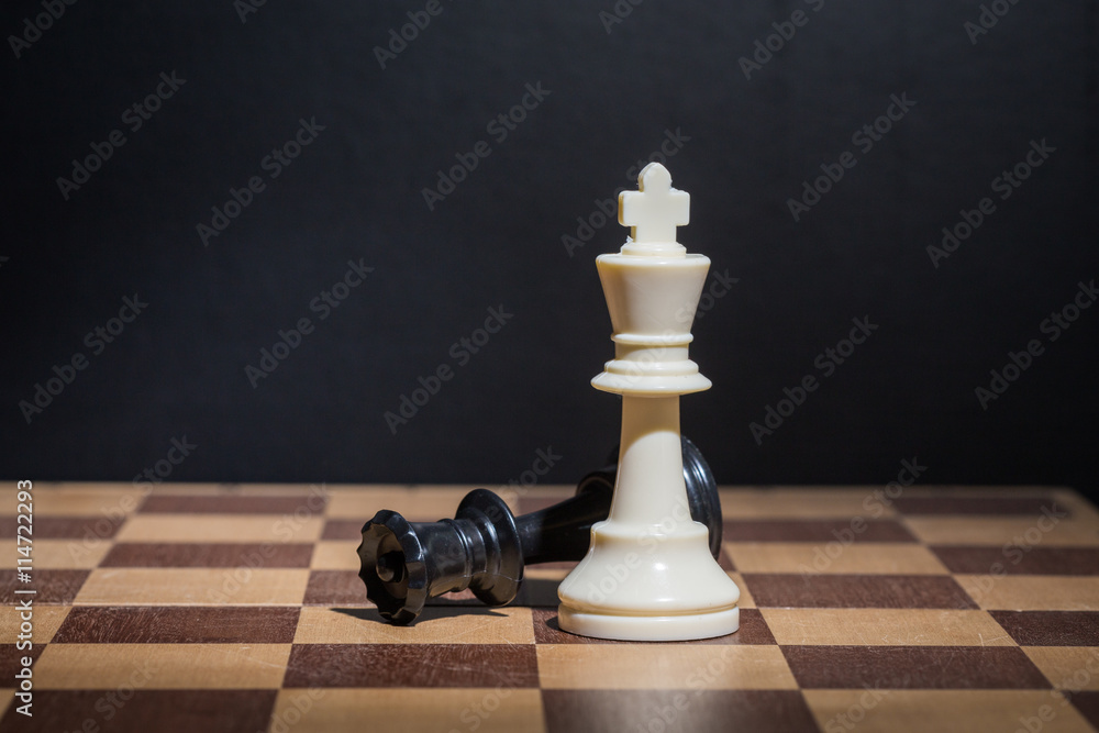 Chess pieces set on a chessboard Chess pieces set on a chessboard