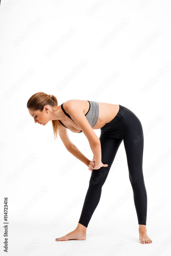 Portrait of young beautiful sportive girl over white background. Portrait of young beautiful sportive girl over white background.