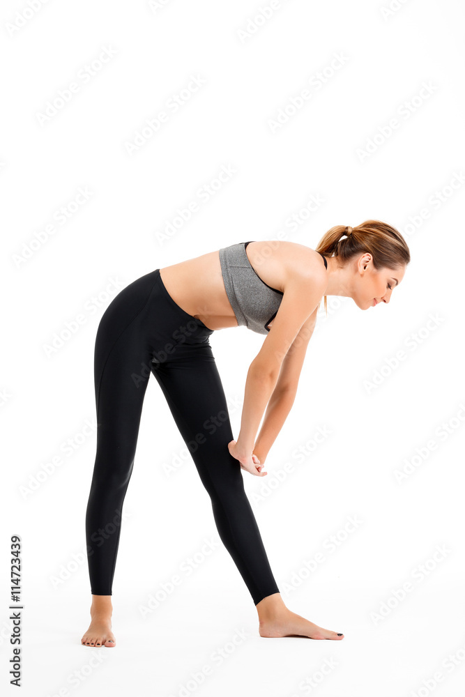 Portrait of young beautiful sportive girl over white background. Portrait of young beautiful sportive girl over white background.
