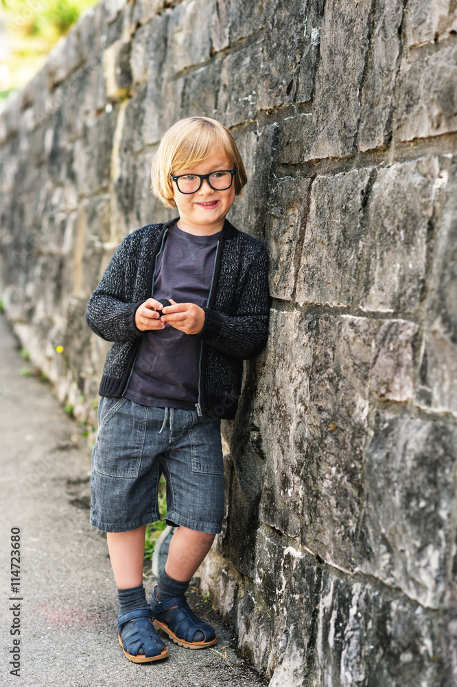 Outdoor portrait of a cute little boy in glasses Outdoor portrait of a cute little boy in glasses
