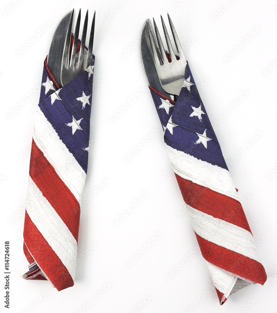 Pair of silverware wrapped in American flag napkins Pair of silverware wrapped in American flag napkins