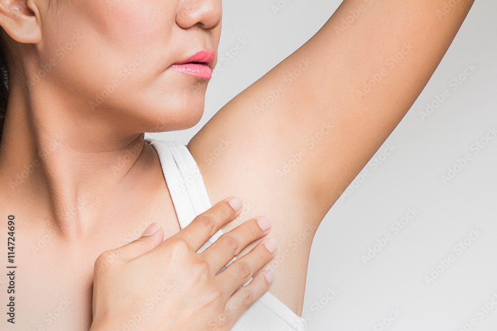 woman holding her arms up and showing underarms woman holding her arms up and showing underarms