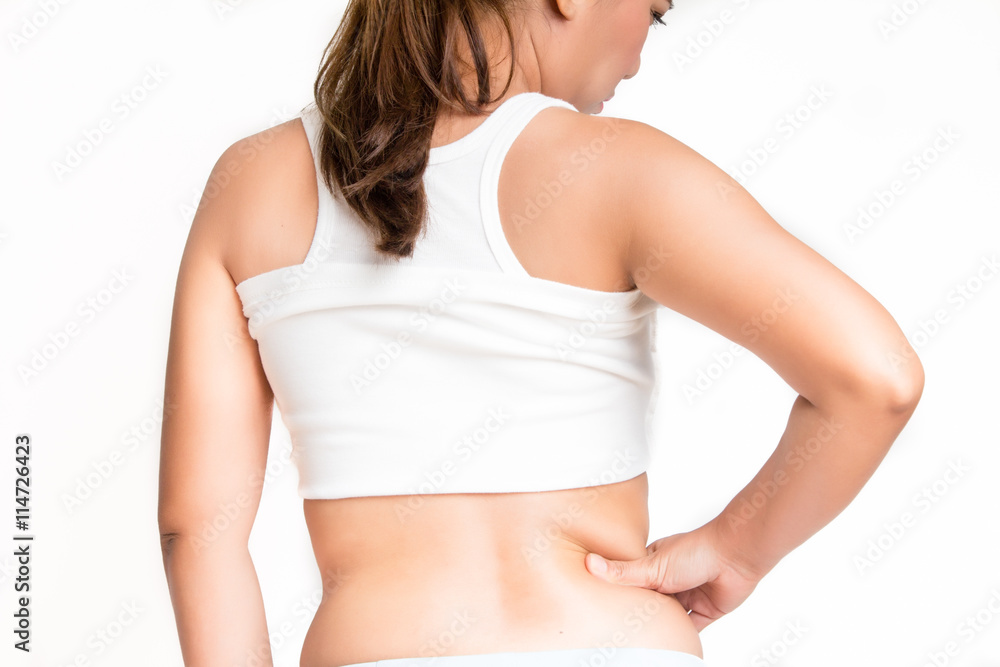 Woman measuring her belly fat with her hands Woman measuring her belly fat with her hands
