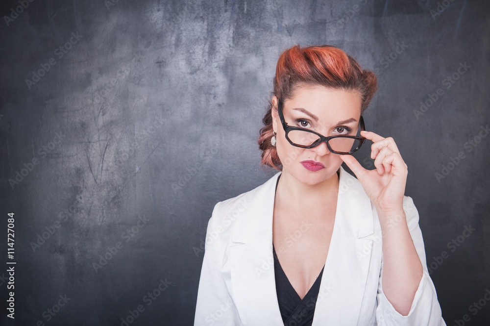 Serious teacher in glasses on blackboard background Stock Photo | Adobe ...