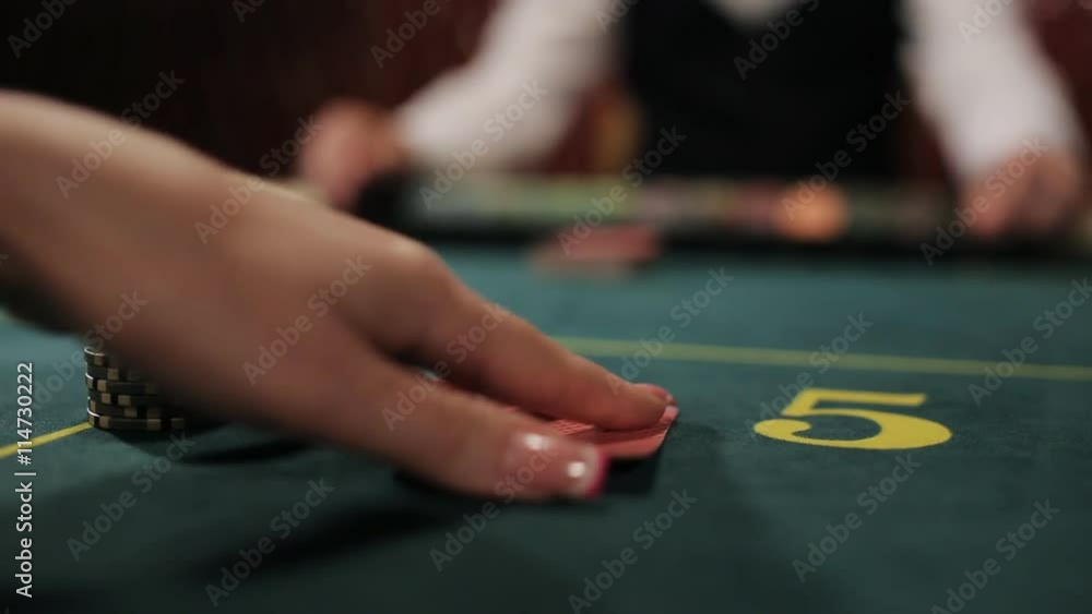 Beautiful girl the player makes a bet in poker and wins. Beautiful girl the player makes a bet in poker and wins. The dealer moves the winning player Beautiful girl the player makes a bet in poker and wins. Beautiful girl the player makes a bet in poker and wins. The dealer moves the winning player