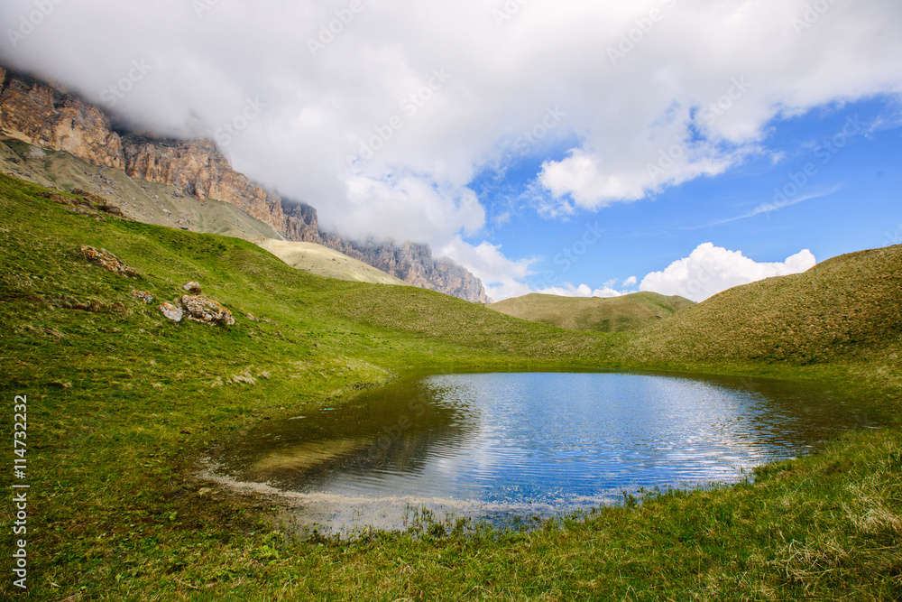 Idyllic summer landscape with clear mountain lake in the Caucasus