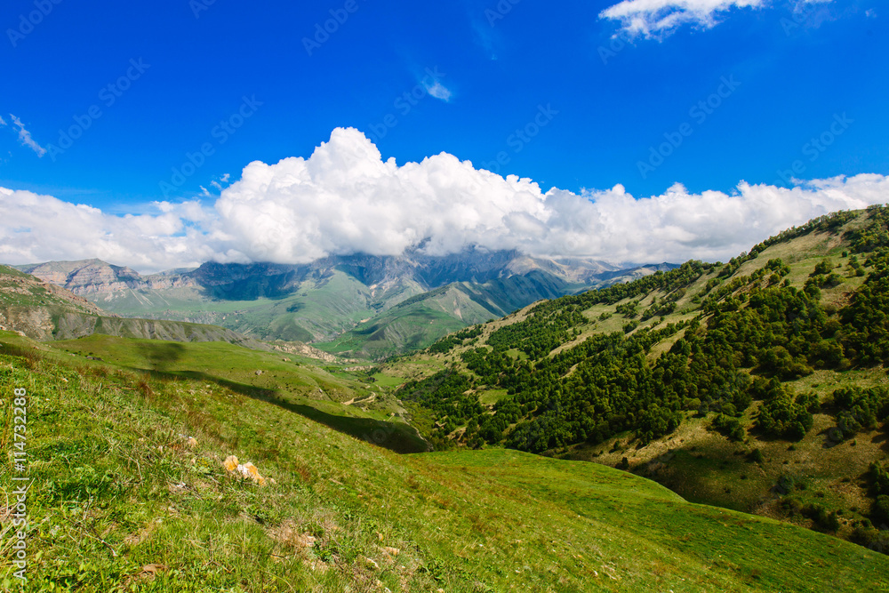 Mountain landscape. Mountain Ridge rushes into the distance and the low-hanging clouds. Caucasus Mountains.