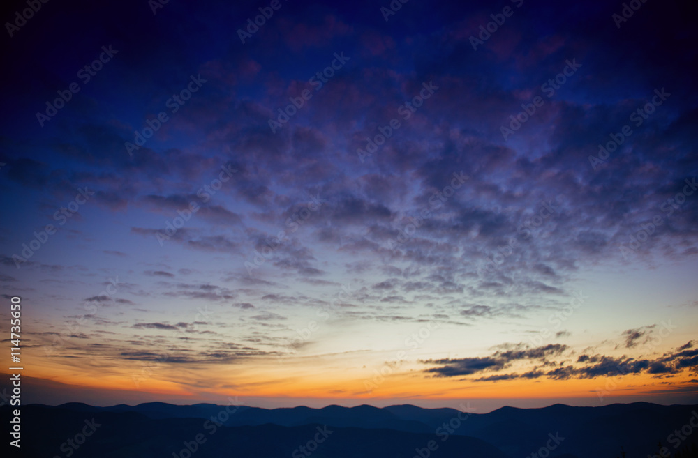 blue color of mountains during sunset. Carpathian, Ukraine.