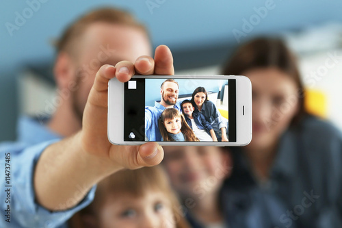 Happy family taking selfie ...