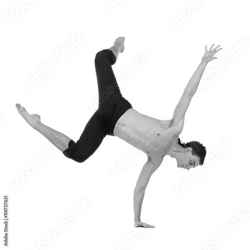 colorless portrait of young and stylish modern ballet dancer jumping