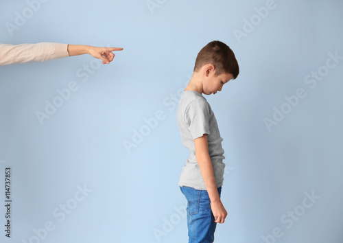 Family problems concept. Mother punishing son