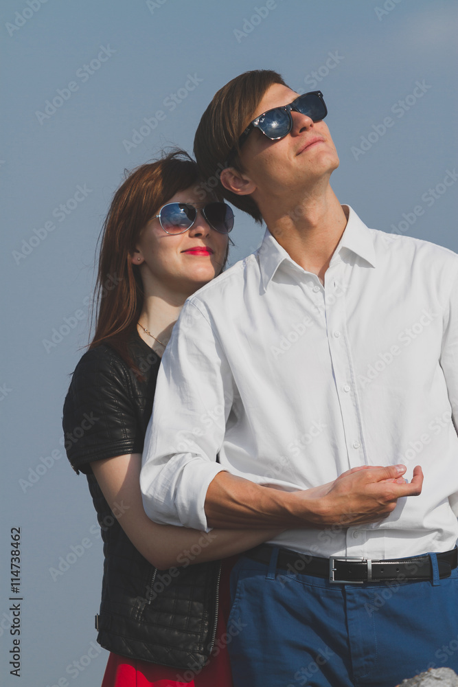 Image of beautiful couple posing on the sea