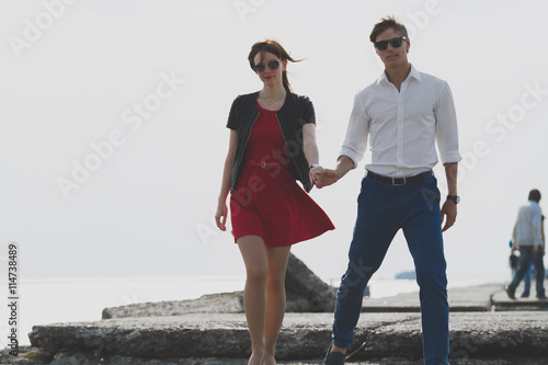 Image of beautiful couple posing on the sea