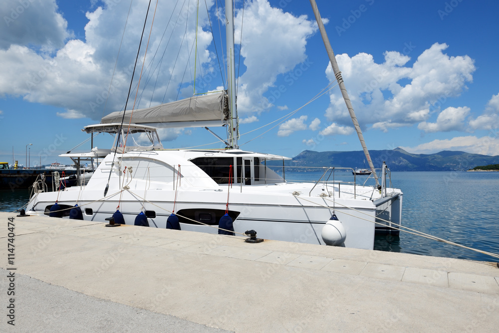 Fototapeta premium The sail yacht is in harbor, Corfu island, Greece