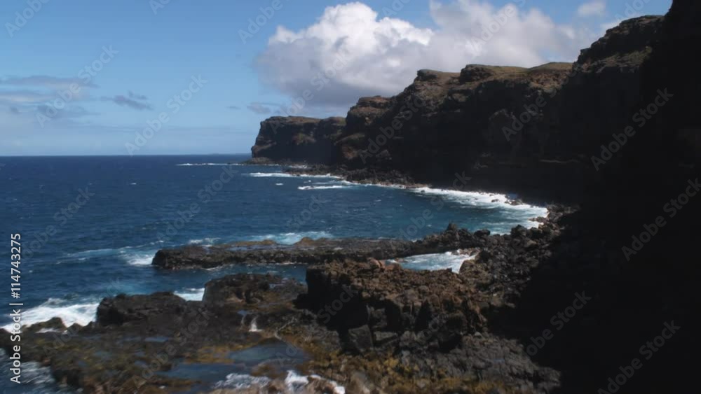 Flying along Molokai's rocky shoreline near the surf. Shot in 2010. Flying along Molokai's rocky shoreline near the surf. Shot in 2010.