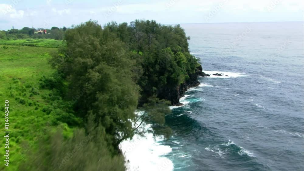 Low flight along shoreline cliff tops in Hawaii Low flight along shoreline cliff tops in Hawaii