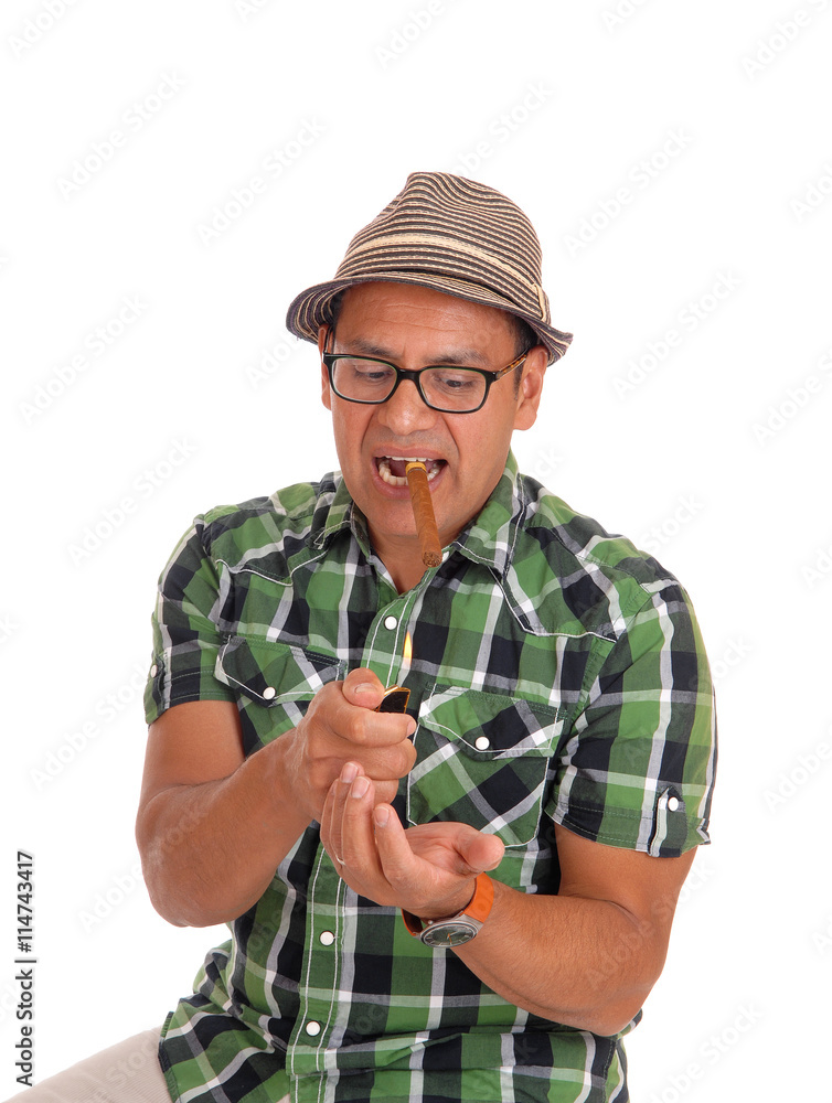 Fototapeta premium Hispanic man try to light his cigar.