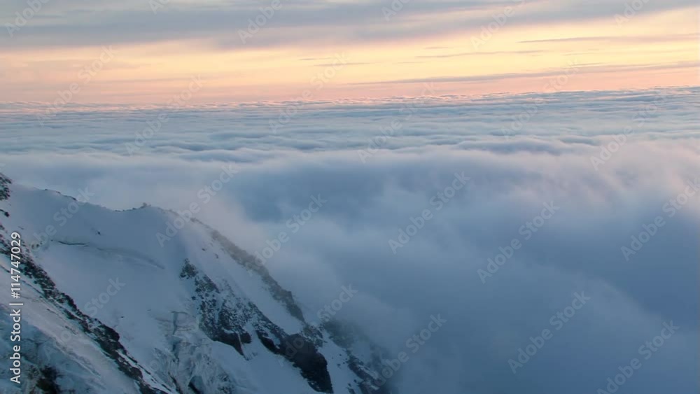 Slow flight past cloud-wrapped summit of Mount Hood in Oregon Slow flight past cloud-wrapped summit of Mount Hood in Oregon