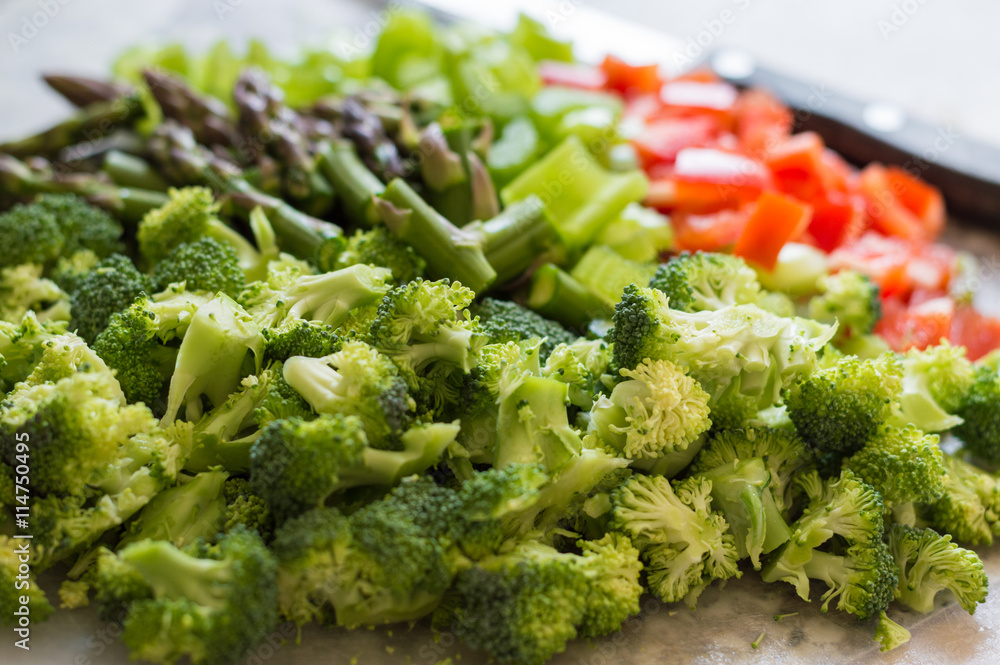 Freshly cut variety of vegetables and knife Freshly cut variety of vegetables and knife