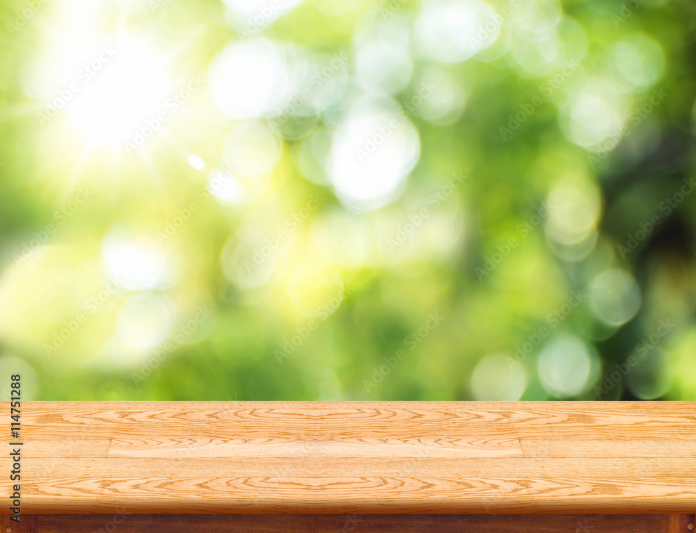 Empty brown wood table top with green blur nature sun light,Mock Empty brown wood table top with green blur nature sun light,Mock