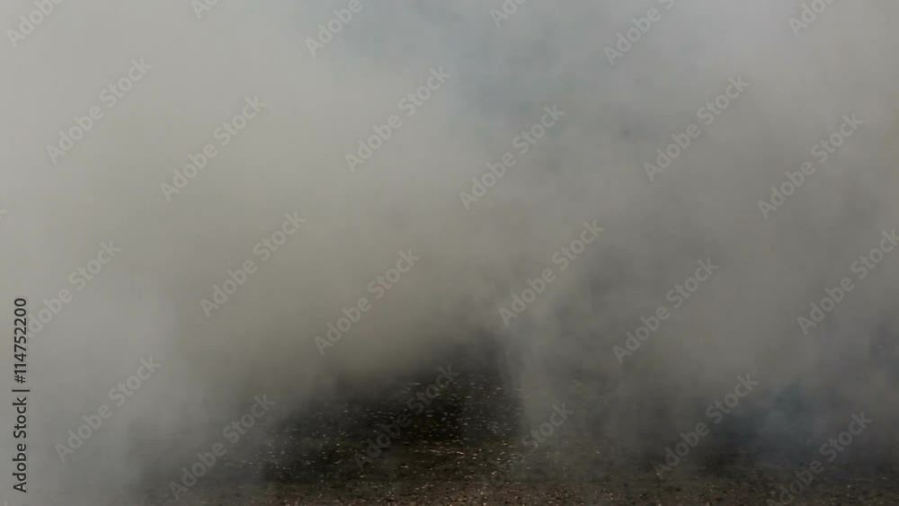 Drag racing car burns rubber off its tire in preparation for the race Drag racing car burns rubber off its tire in preparation for the race