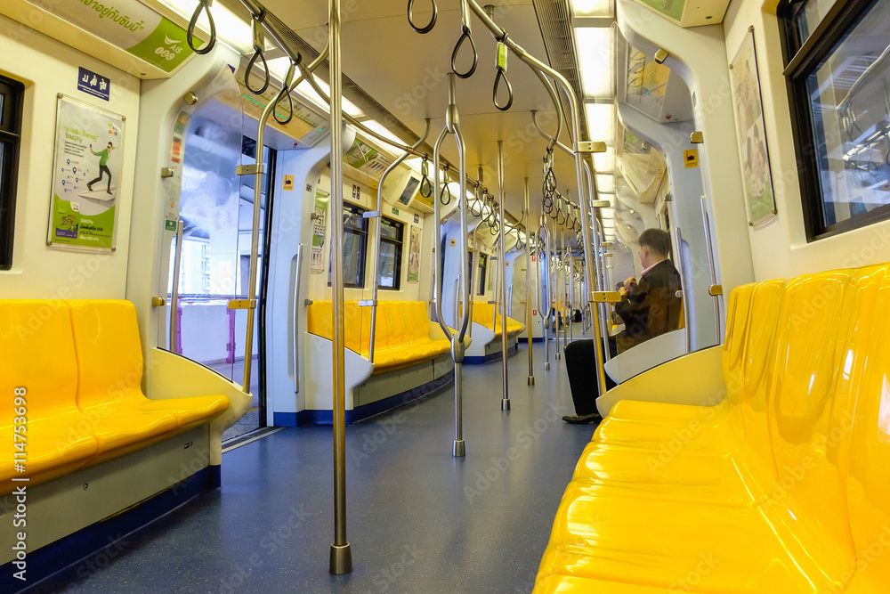 Fototapeta premium Overview of yellow seats in electric train