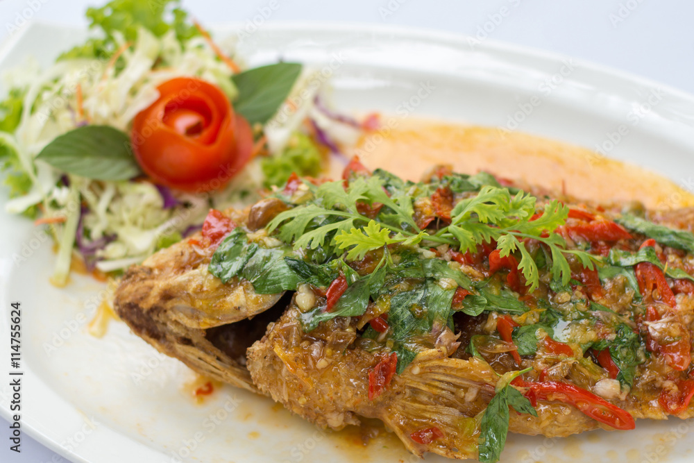 Deep fried red tilapia topped with sweet and sour sauce on top, Deep fried red tilapia topped with sweet and sour sauce on top,