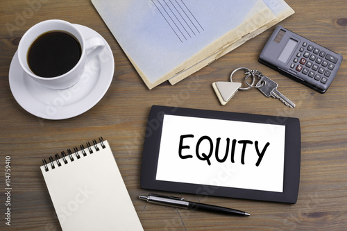 EQUITY. Text on tablet device on a wooden table