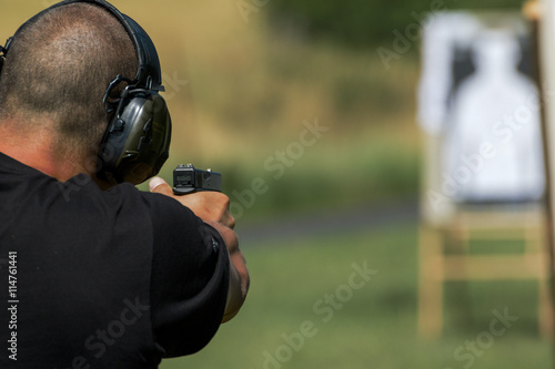 Police shooting practice at a shooting range photo